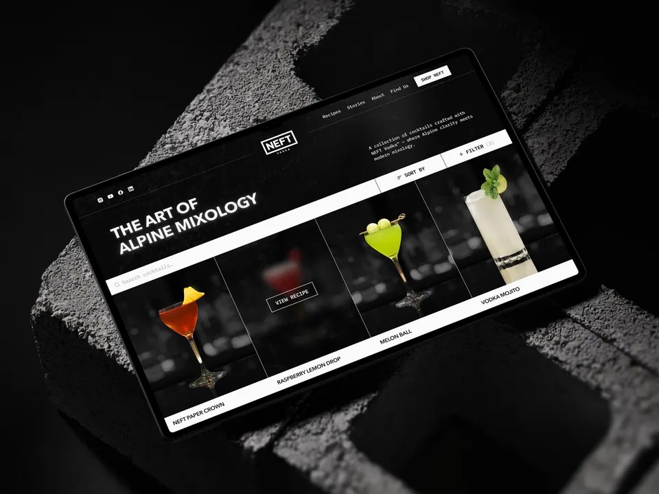 NEFT Vodka website — 'The Art of Alpine Mixology' on a laptop